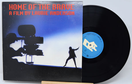 Vinyl record with cover titled 'Home of the Brave' by Laurie Anderson on a white background