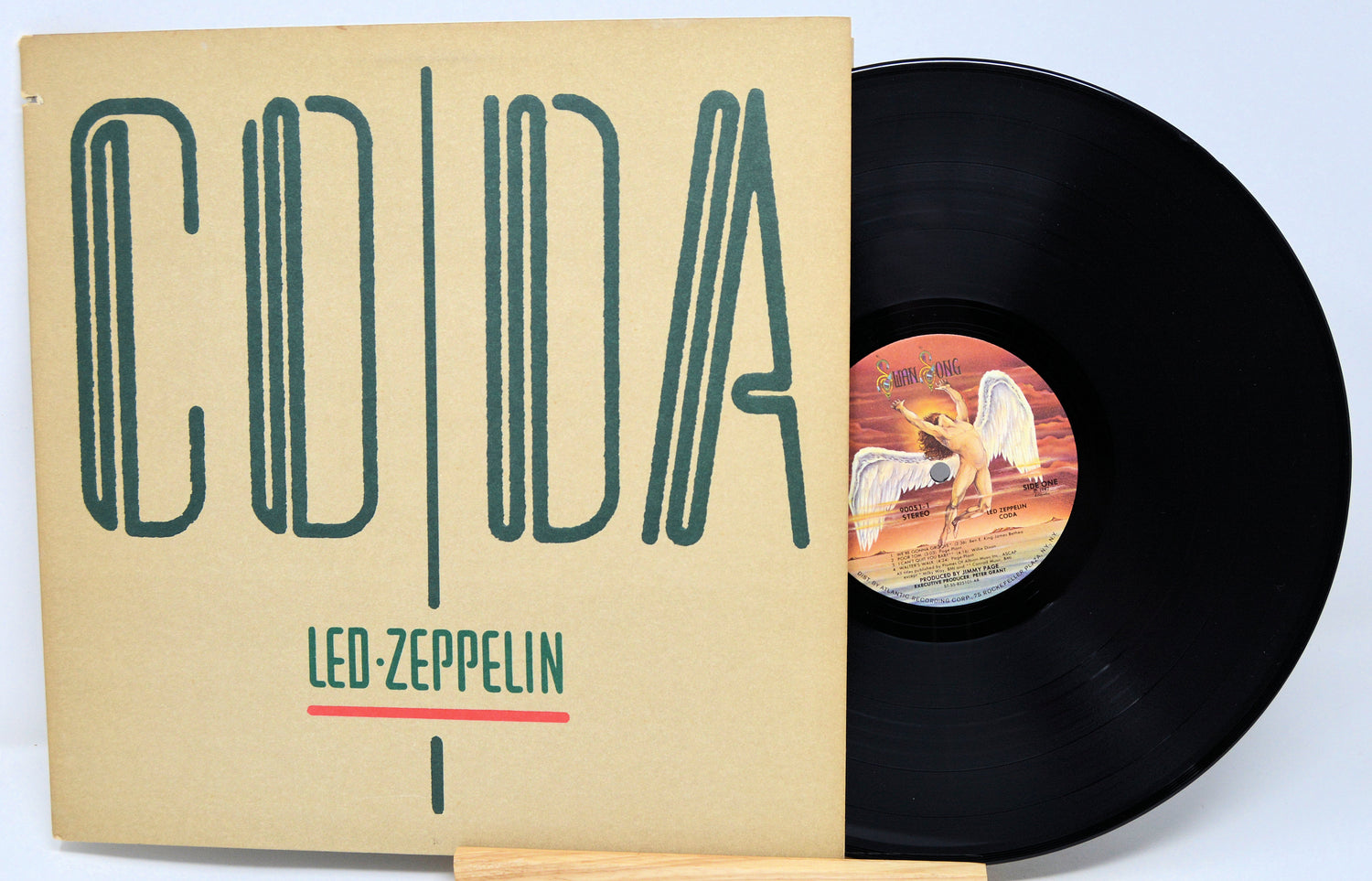 Vinyl record with 'Coda' by Led Zeppelin on a beige cover
