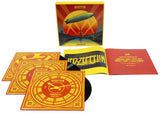 Led Zeppelin vinyl record set with colorful packaging and booklets on a white background