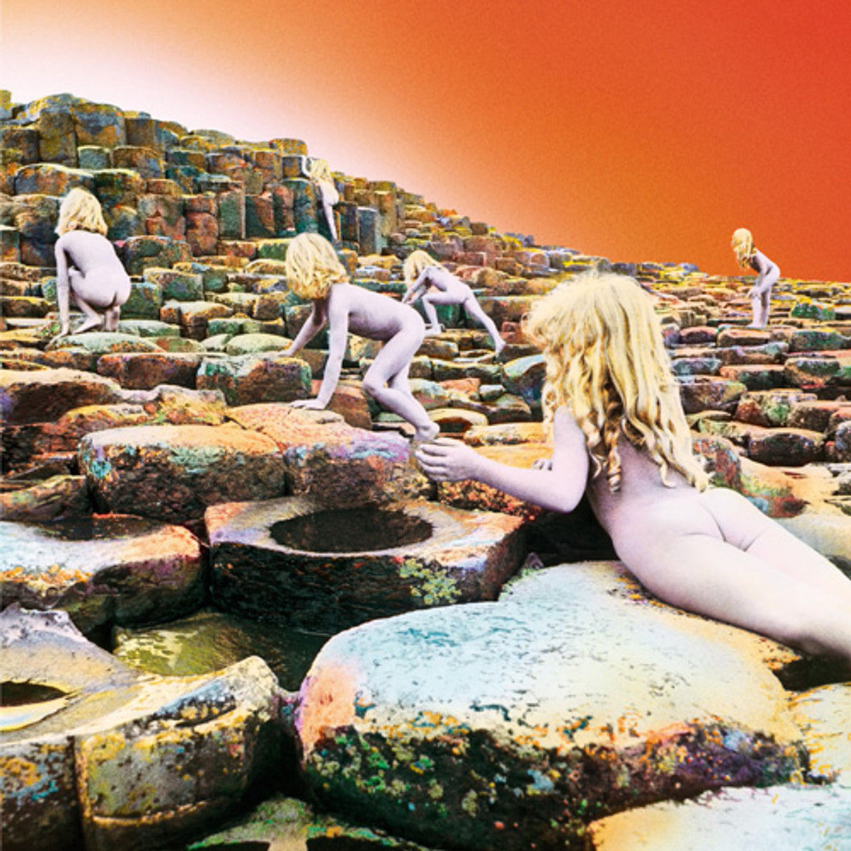 Led Zeppelin - Houses Of The Holy The album cover features a colorful illustration of a rocky landscape with orange sky.