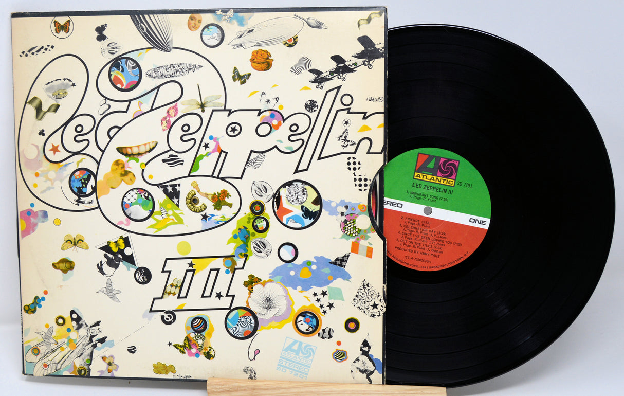 Vinyl record and cover with colorful design on a white background