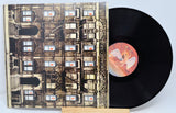 Led Zeppelin - Physical Graffiti album cover with a black vinyl record visible