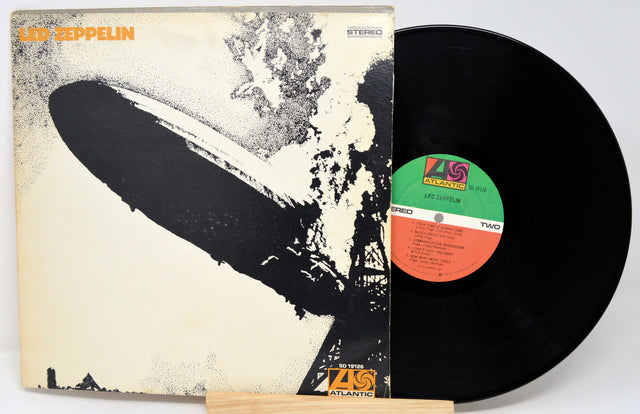 Vinyl record and cover with Led Zeppelin artwork on a white background
