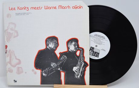Front album cover of Lee Konitz meets Warne Marsh Again with vinyl, showing both musicians with saxophones