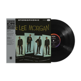 A vinyl record and its cover featuring Lee Morgan, with the title 'HERE'S LEE MORGAN' on the cover. The vinyl record is black, and the cover has text and an image of Lee Morgan in a suit.
