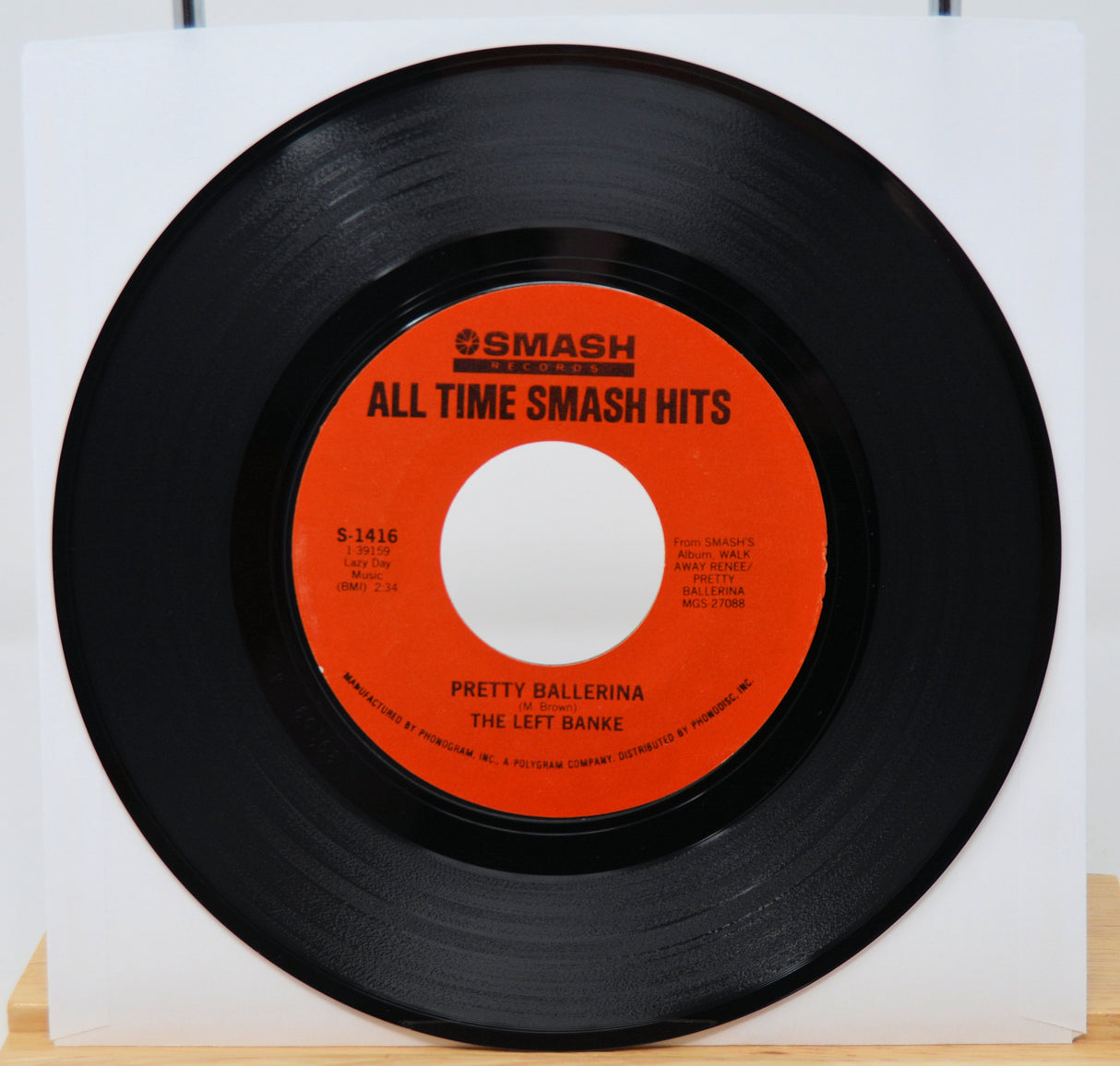 Vinyl record with red label titled 'All Time Smash Hits' on a white background