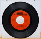 Vinyl record with red label titled 'All Time Smash Hits' on a white background