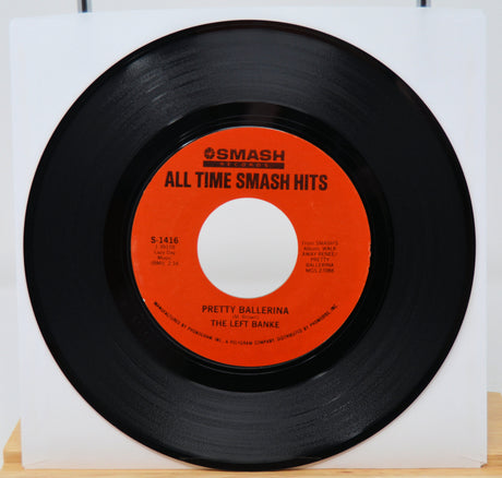 Vinyl record with red label titled 'All Time Smash Hits' on a white background