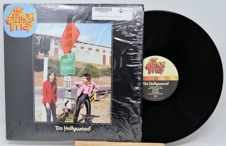 Vinyl record with cover featuring 'The Lemon Twigs' and 'Do Hollywood' on a white background