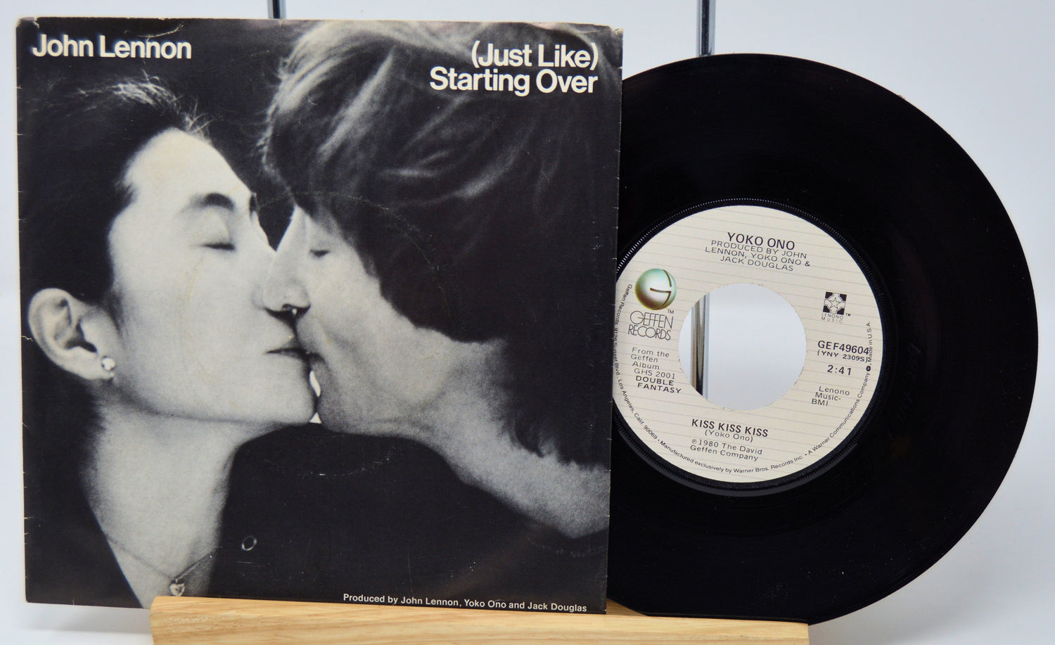 Vinyl record and cover featuring a couple kissing with 'John Lennon' text.
