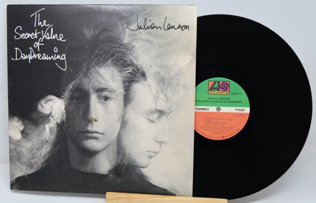 Vinyl record with cover featuring a black and white portrait and album details.