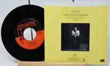 Vinyl record and its cover with Atlantic Records logo on a white background