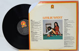 Vinyl record with cover featuring a woman and text on a light gray background