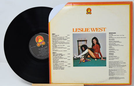 Vinyl record with cover featuring a woman and text on a light gray background