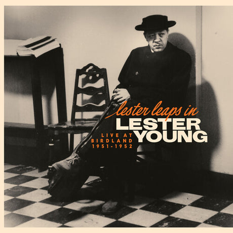 Vinyl album cover of Lester Young 'Leaps In Live At Birdland 1951-1952' featuring a black and white photo of him sitting on a checkered floor with text overlay.