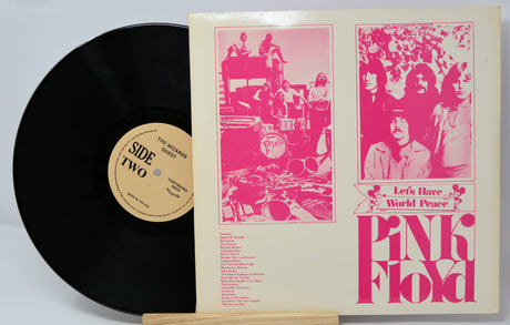 Pink Floyd Let's Have World Peace vintage vinyl record and album cover with band photos in pink design