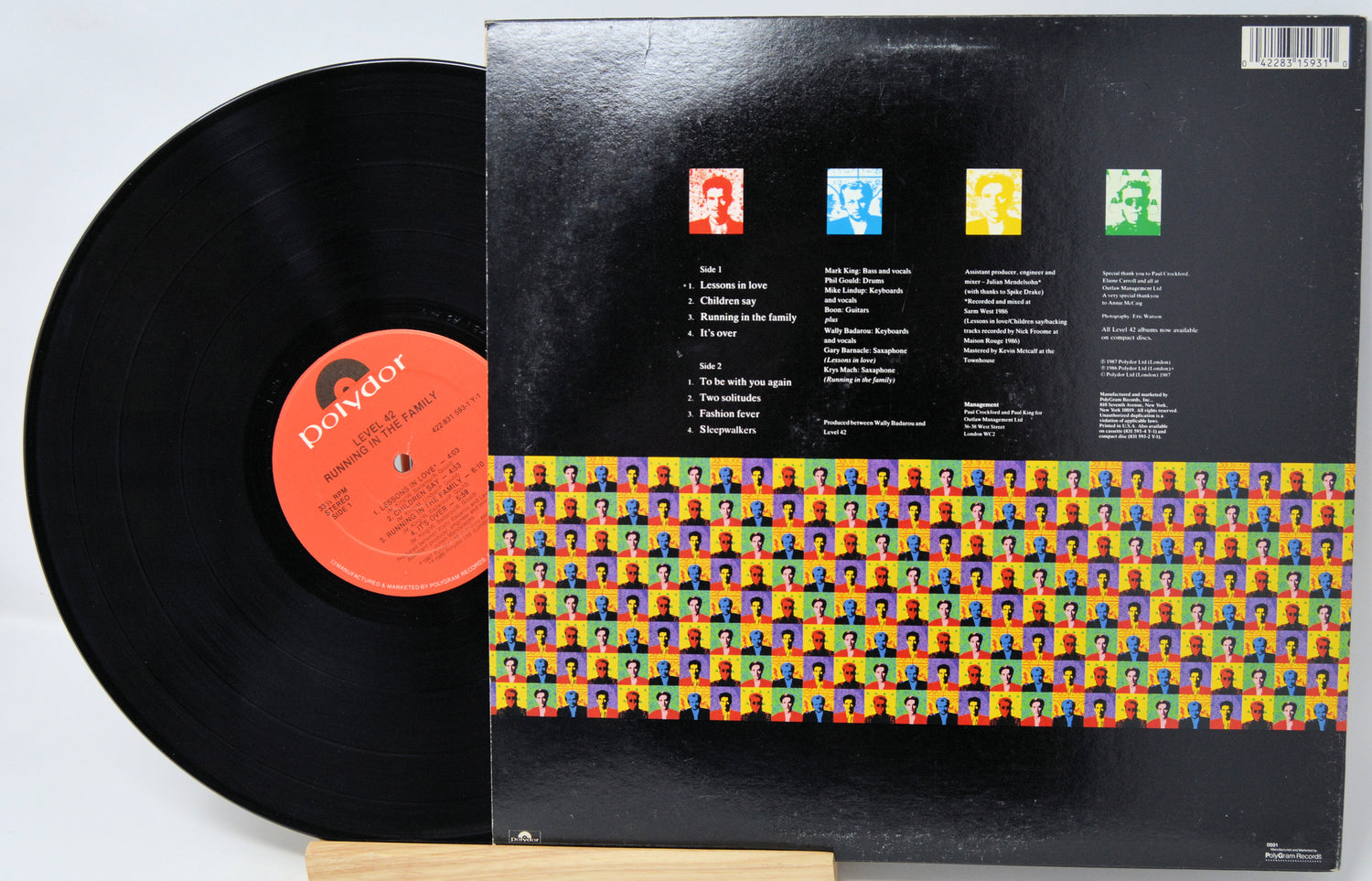 Vinyl record with colorful cover design on a white background