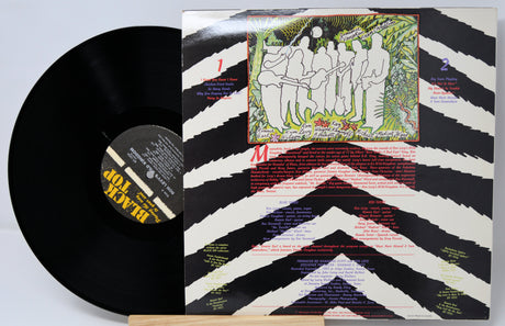 Vinyl record with colorful cover featuring artistic design and text.