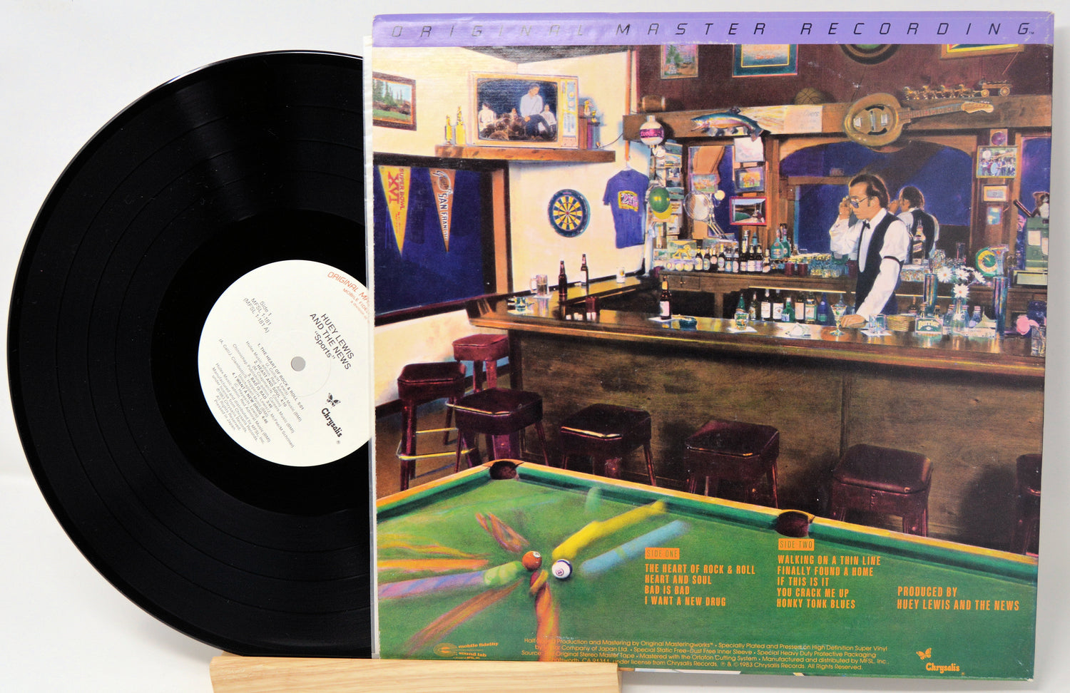 Vinyl record with a cover featuring a bar scene