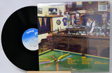 Vinyl record with a pool table scene on the cover