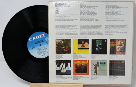 Vinyl record with a colorful cover displaying album art and text on a white background