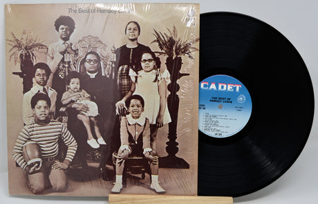 Vinyl record with a black and white photo cover featuring a family and 'Cadet' branding.