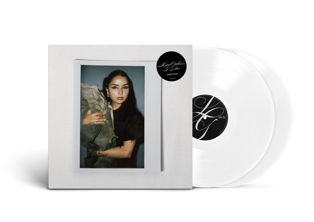 Vinyl records with a white cover featuring an image of Lexa Gates and a black and white label.
