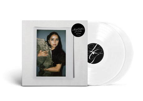 Vinyl records with a white cover featuring an image of Lexa Gates and a black and white label.