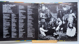 Album cover with text on the left and a black and white photo of people on the right.