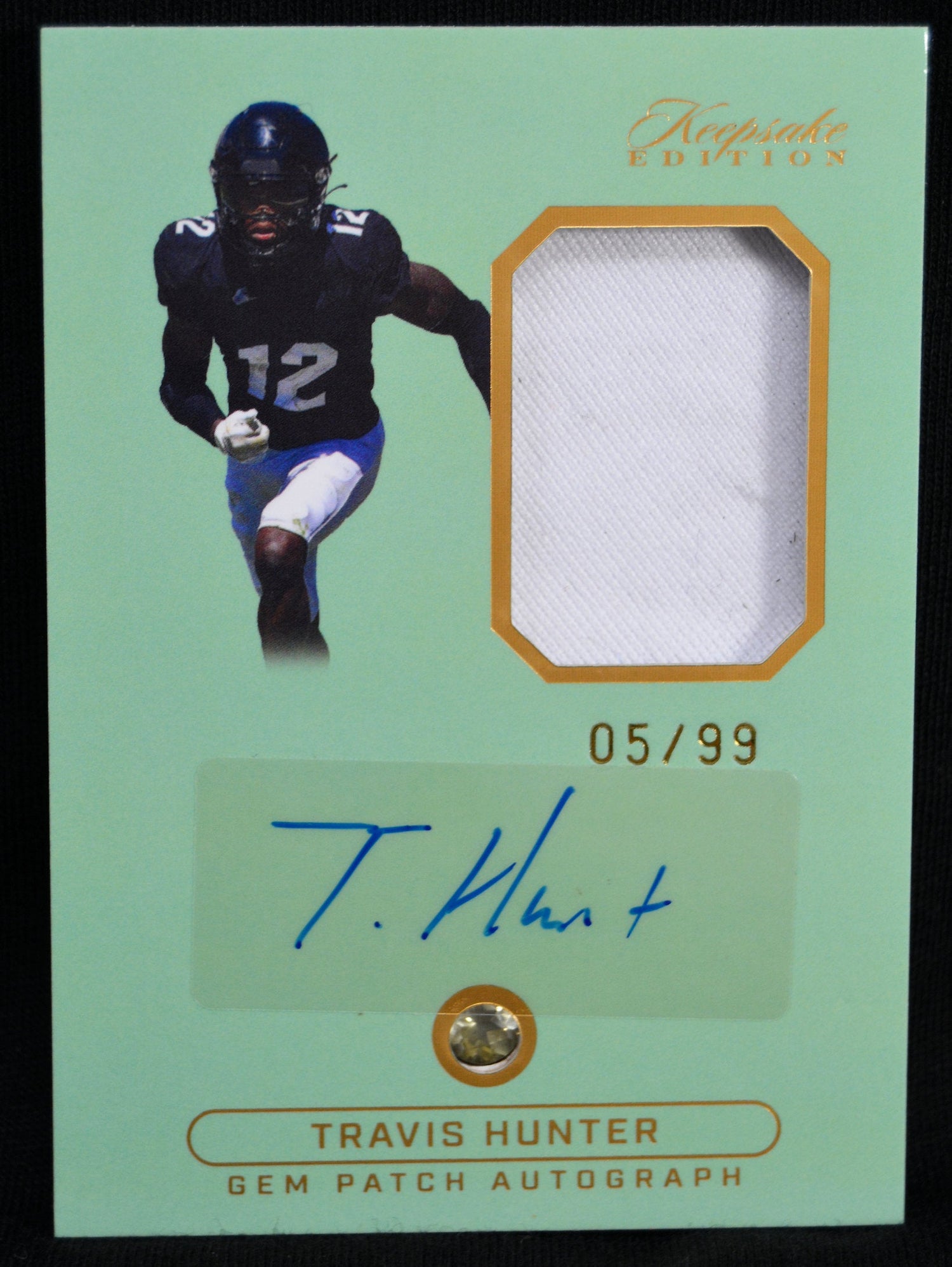 Travis Hunter Gem Patch Autograph card, numbered 05/99, including signature and memorabilia patch