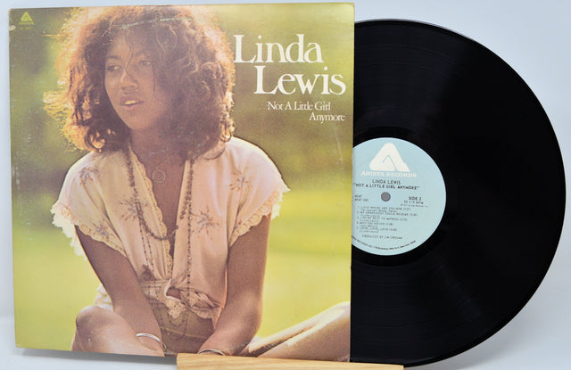 Vinyl record with cover featuring a woman, titled 'Not A Little Girl Any More' by Linda Lewis.