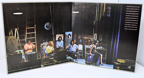 Album cover with multiple images of people in a room on a black background