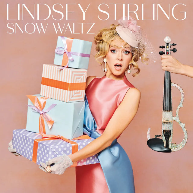 Album cover featuring a woman with gifts and a violin, with 'Lindsey Stirling Snow Waltz' text.