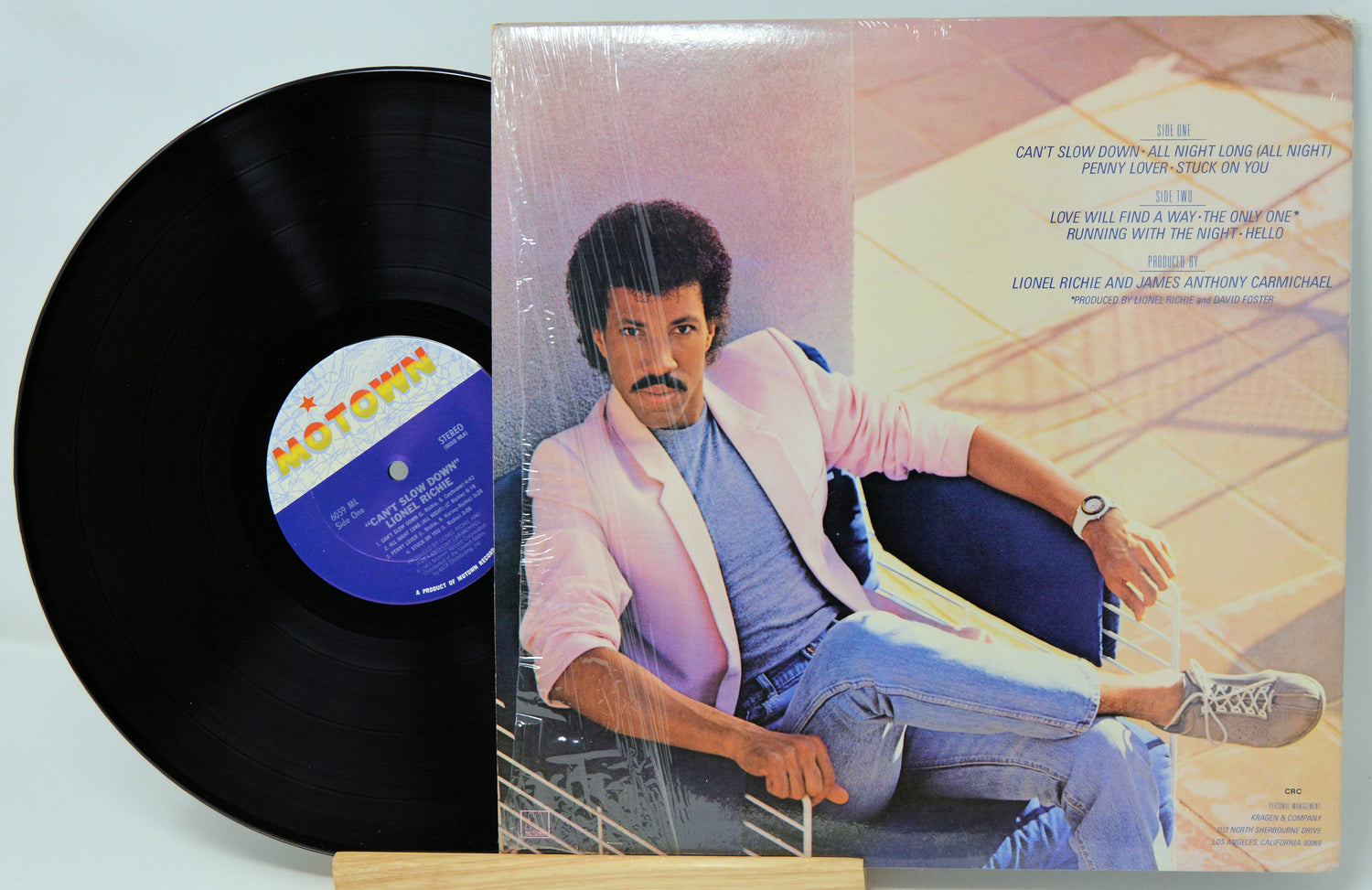 Vinyl record with a cover featuring a person leaning against a wall.