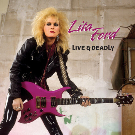Lita Ford rocking a leather jacket and pink guitar on the Live & Deadly album cover