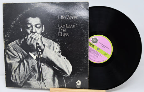 Vinyl record with cover featuring a musician and 'Little Walter Confessin' The Blues' text.