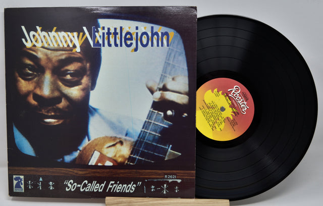 Vinyl record with cover featuring a musician and album title 'So-Called Friends' by Johnny Littlejohn.