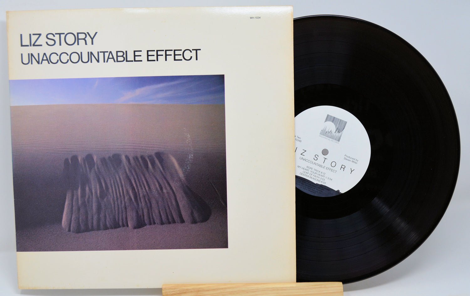 Vinyl record and cover titled 'Unaccountable Effect' by Liz Story on a light gray background