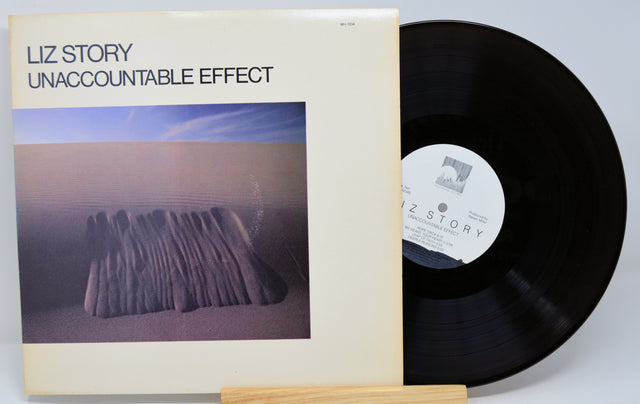 Vinyl record and cover titled 'Unaccountable Effect' by Liz Story on a light gray background