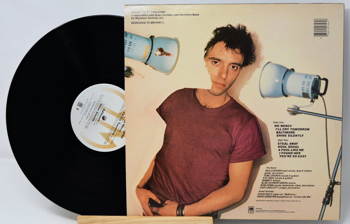Vinyl record with a person on the cover and text on the back