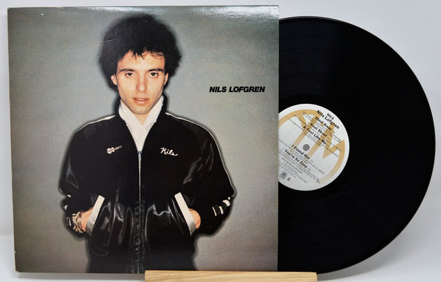 Vinyl record with a portrait of a person on the cover and a visible label.