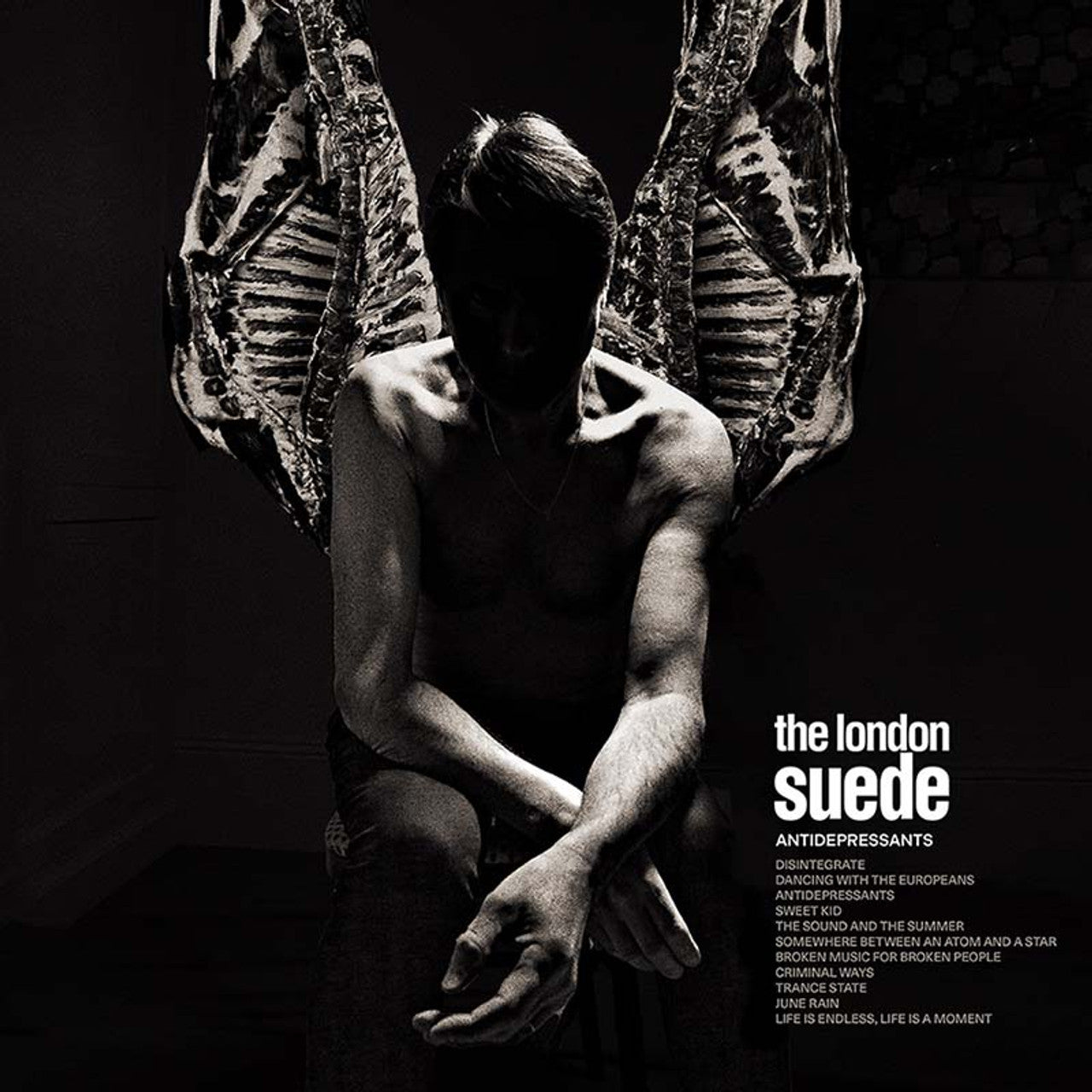 Dramatic black-and-white album cover featuring a shirtless figure with angel-like wings for London Suede's 'Antidepressants'