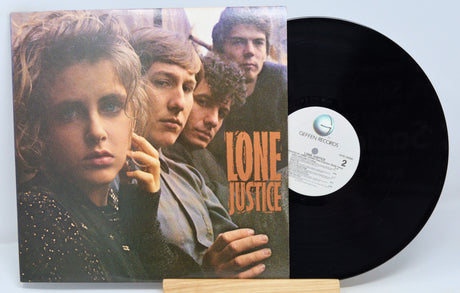 Used vinyl record album cover for Lone Justice self-titled album featuring a group photo of the band members.