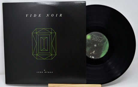 Vinyl record with cover titled 'Vide Noir' on a white background