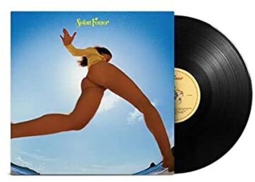 Vinyl record with a cover featuring a person in a yoga pose against a blue sky.