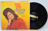 Front cover of Loretta Lynn Fist City vinyl record with portrait and vibrant yellow background