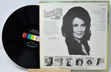 Back cover of Loretta Lynn's 'You're Lookin' At Country' vinyl record album with portrait and tracklist