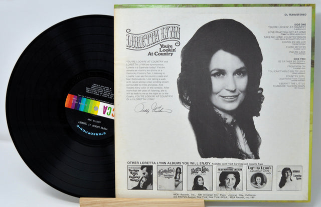 Back cover of Loretta Lynn's 'You're Lookin' At Country' vinyl record album with portrait and tracklist
