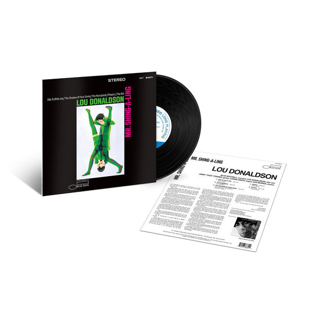 Vinyl record album package for Lou Donaldson's 'Mr. Singing-A-Log' shown with the black record partially pulled from the sleeve and the printed inner sleeve laid out beside it on a white background.