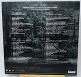Back cover of a music album with tracklist and production credits on a dark background